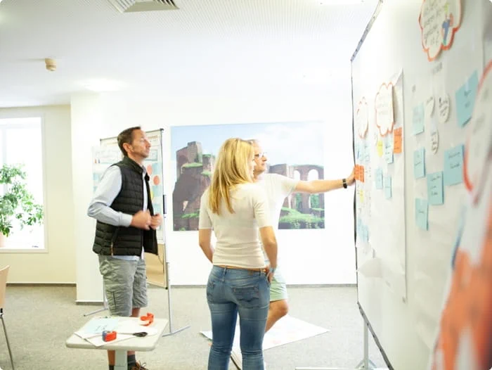 Three colleagues brainstorming together