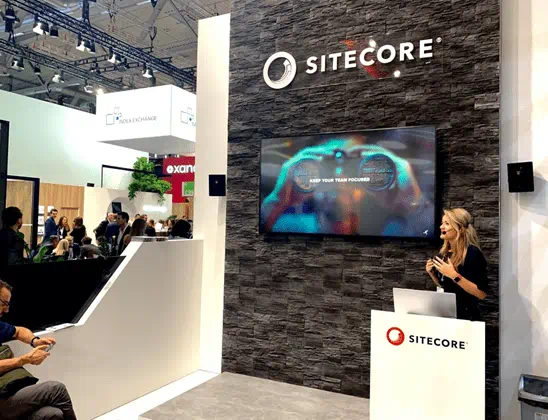 Canvas Reply colleague presenting at the Sitecore trade fair booth